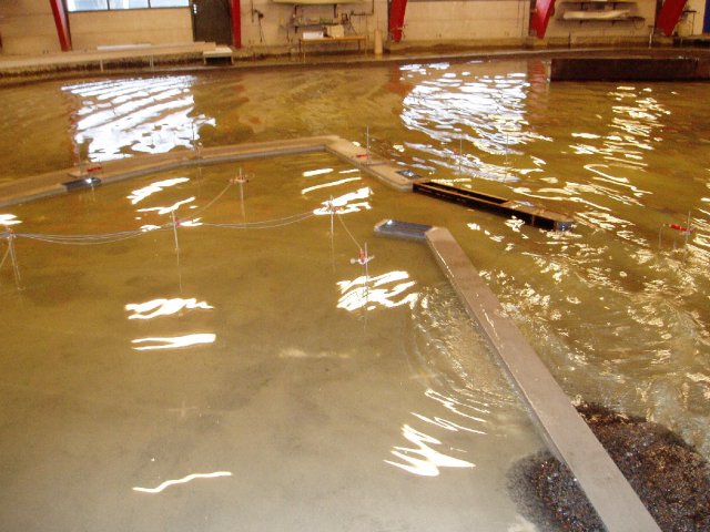 Wave overtopping breakwater in marina model