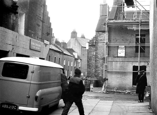 Demolition of Tom Brass's shop